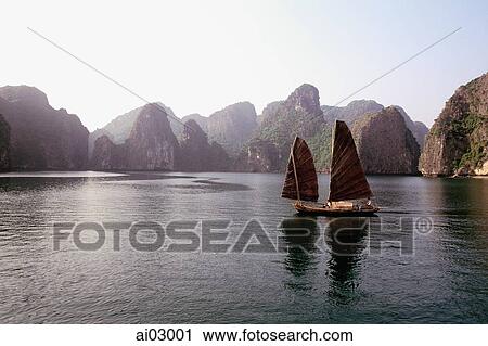 Vietnam, Halong Bay, Fishing junk sailing amongst the islands View Large Photo Image Stock Image - Vietnam, Halong Bay, Fishing junk sailing amongst the islands. Fotosearch