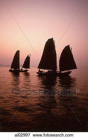 Vietnam, Halong Bay, Fishing junks at dawn View Large Photo Image Stock Photo - Vietnam, Halong Bay, Fishing junks at dawn. Fotosearch