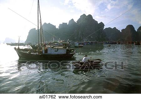 Vietnam, Halong Bay, woman rowing boat. View Large Photo Image Stock Image - Vietnam, Halong Bay, woman rowing boat.. Fotosearch