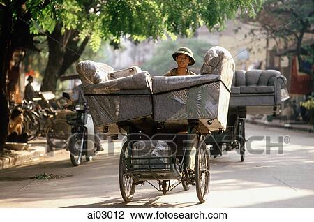 Vietnam, Hanoi, man delivering armchairs on cyclo View Large Photo Image Stock Image - Vietnam, Hanoi, man delivering armchairs on cyclo. Fotosearch