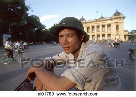 Stock Photo - Vietnam, Hanoi, pedicab driver in front of Municipal Theatre.. Fotosearch