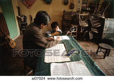 Vietnam, Hanoi, teacher and student at music school View Large Photo Image Picture - Vietnam, Hanoi, teacher and student at music school. Fotosearch