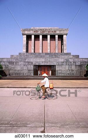 Vietnam, Hanoi, woman cycling past Ho Chi-Minh's mausoleum View Large Photo Image Stock Image - Vietnam, Hanoi, woman cycling past Ho Chi-Minh's mausoleum. Fotosearch