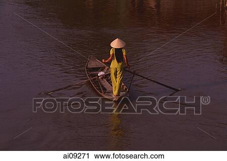 Vietnam, Hau Liang province, Mekong delta, Woman in sampan. View Large Photo Image Stock Image - Vietnam, Hau Liang province, Mekong delta, Woman in sampan.. Fotosearch