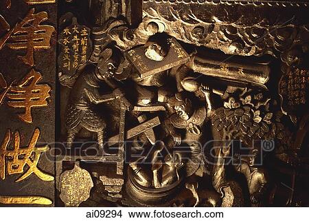Picture - Vietnam, Ho Chi Minh city, Emperor of Jade Pagoda, Carvings on wall depicting hell.. Fotosearch