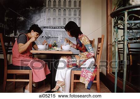 Vietnam, Ho Chi Minh City, Patrons eating at the Givral Restaurant (featured in film: The Quiet American). View Large Photo Image Stock Photography - Vietnam, Ho Chi Minh City, Patrons eating at the Givral Restaurant (featured in film: The Quiet American).. Fotosearch