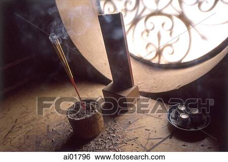 Stock Photograph - Vietnam, Ho Chi Minh City (Saigon), incense offering at Buddhist temple in Cholon (close-up).. Fotosearch