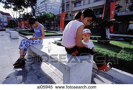 Vietnam, Ho Chi Minh City (Saigon), Vietnamese relaxing in Lam Son Square. View Large Photo Image Stock Photography - Vietnam, Ho Chi Minh City (Saigon), Vietnamese relaxing in Lam Son Square.. Fotosearch