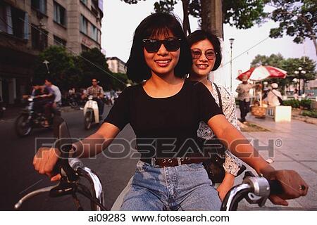 Vietnam, Ho Chi Minh city, Teenage girls on moped. View Large Photo Image Stock Image - Vietnam, Ho Chi Minh city, Teenage girls on moped.. Fotosearch
