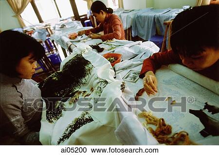 Vietnam, Hoi An, Women in a shop embroidering tapestries. View Large Photo Image Stock Image - Vietnam, Hoi An, Women in a shop embroidering tapestries.. Fotosearch