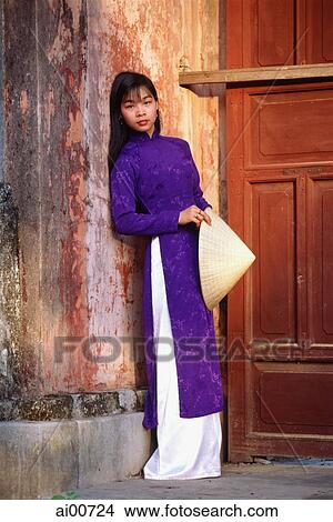 Vietnam, Hue, the Citadel, woman in traditional Vietnamese dress View Large Photo Image Picture - Vietnam, Hue, the Citadel, woman in traditional Vietnamese dress. Fotosearch