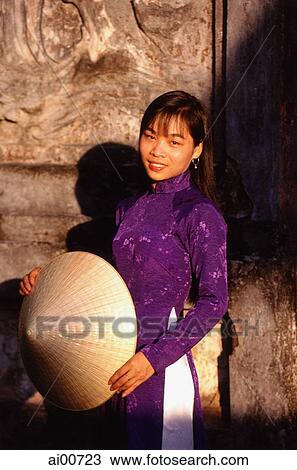 Vietnam, Hue, the Citadel, woman in traditional dress View Large Photo Image Stock Image - Vietnam, Hue, the Citadel, woman in traditional dress. Fotosearch