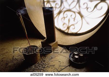Stock Photo - Vietnam, Incense burning by window.. Fotosearch
