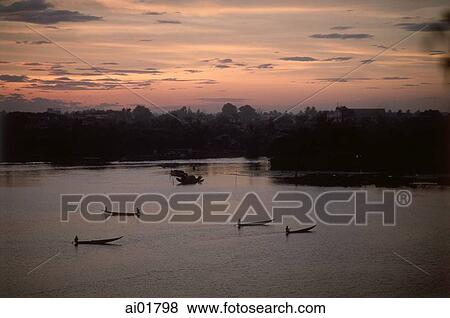 Stock Photo - Vietnam, near Hue, boats on Perfume River at sunset.. Fotosearch