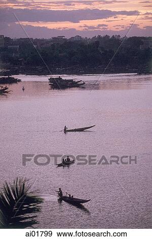 Vietnam, near Hue, boats on Perfume River at sunset. View Large Photo Image Stock Photo - Vietnam, near Hue, boats on Perfume River at sunset.. Fotosearch