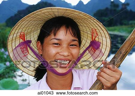 Vietnam, Perfume Pagoda, Hanoi, Vietnamese girl rowing a small boat View Large Photo Image Stock Image - Vietnam, Perfume Pagoda, Hanoi, Vietnamese girl rowing a small boat. Fotosearch