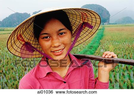 Vietnam, Perfume Pagoda, Hanoi, Young woman carrying baskets in rice paddies View Large Photo Image Stock Photograph - Vietnam, Perfume Pagoda, Hanoi, Young woman carrying baskets in rice paddies. Fotosearch