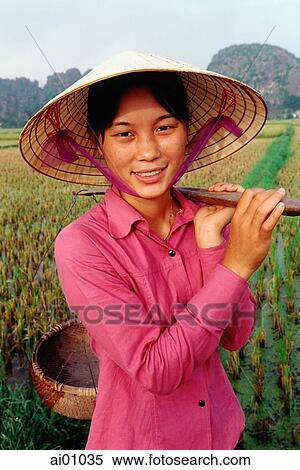 Vietnam, Perfume Pagoda, Hanoi, Young woman carrying baskets in rice paddies View Large Photo Image Stock Photography - Vietnam, Perfume Pagoda, Hanoi, Young woman carrying baskets in rice paddies. Fotosearch