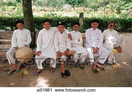 Vietnam, Tay Ninh, Cao Dai elderly worshippers at park of Cao Dai Holy Sea. View Large Photo Image Stock Image - Vietnam, Tay Ninh, Cao Dai elderly worshippers at park of Cao Dai Holy Sea.. Fotosearch