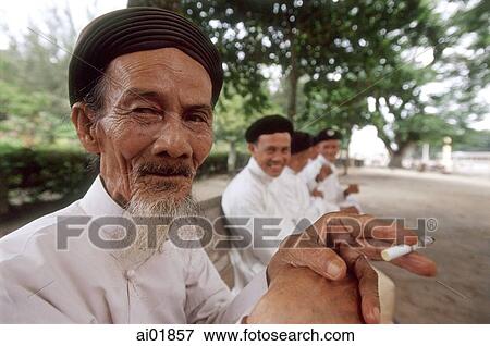 Vietnam, Tay Ninh, Cao Dai followers in park of Cao Dai Holy Sea. View Large Photo Image Stock Photo - Vietnam, Tay Ninh, Cao Dai followers in park of Cao Dai Holy Sea.. Fotosearch