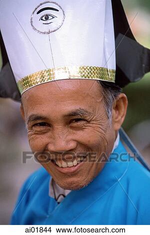Vietnam, Tay Ninh, Cao Dai lay priest portrait (close up). View Large Photo Image Picture - Vietnam, Tay Ninh, Cao Dai lay priest portrait (close up).. Fotosearch
