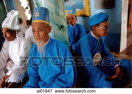 Vietnam, Tay Ninh, Cao Dai lay priests sitting in Cao Dai Great Temple. View Large Photo Image Stock Photo - Vietnam, Tay Ninh, Cao Dai lay priests sitting in Cao Dai Great Temple.. Fotosearch