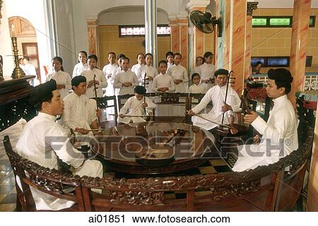 Stock Image - Vietnam, Tay Ninh, Cao Dai musicians and singers in Cao Dai Great Temple.. Fotosearch