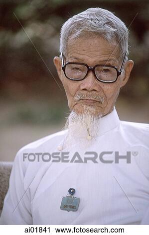 Vietnam, Tay Ninh, Cao Dai priest in white robe (close up). View Large Photo Image Stock Image - Vietnam, Tay Ninh, Cao Dai priest in white robe (close up).. Fotosearch