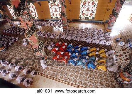 Stock Image - Vietnam, Tay Ninh, Cao Dai priests and worshippers.. Fotosearch
