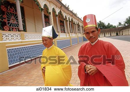 Vietnam, Tay Ninh, Cao Dai priests walking outside of Cao Dai Great Temple. View Large Photo Image Picture - Vietnam, Tay Ninh, Cao Dai priests walking outside of Cao Dai Great Temple.. Fotosearch