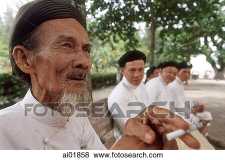 Vietnam, Tay Ninh, Cao Dai worshippers in park of Cao Dai Holy Sea. View Large Photo Image Stock Photo - Vietnam, Tay Ninh, Cao Dai worshippers in park of Cao Dai Holy Sea.. Fotosearch
