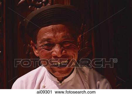 Vietnam, Tay Ninh, Caodist devotee in front of door at Holy See Temple. View Large Photo Image Stock Image - Vietnam, Tay Ninh, Caodist devotee in front of door at Holy See Temple.. Fotosearch
