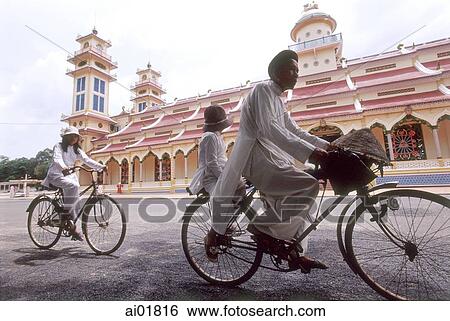 Vietnam, Tay Ninh, worshippers on bicycle outside Cao Dai Great Temple. View Large Photo Image Stock Photograph - Vietnam, Tay Ninh, worshippers on bicycle outside Cao Dai Great Temple.. Fotosearch