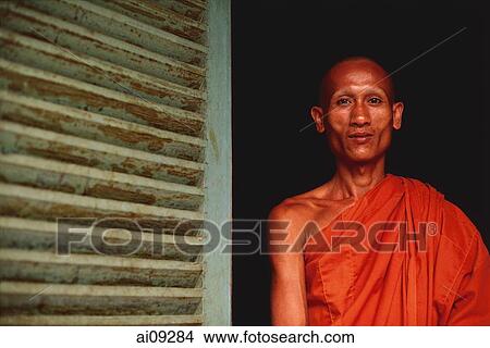 Picture - Vietnam, Trang Vinh Pagoda, Khmer Buddhist monk in pagoda doorway.. Fotosearch