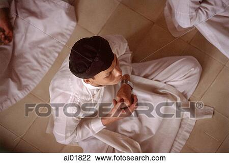 Vietnam, worshipper in cross-legged position in Cao Dai Great Temple. View Large Photo Image Stock Image - Vietnam, worshipper in cross-legged position in Cao Dai Great Temple.. Fotosearch