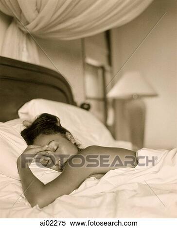 Woman covered in sheet, sleeping in bed View Large Photo Image Stock Photography - Woman covered in sheet, sleeping in bed. Fotosearch
