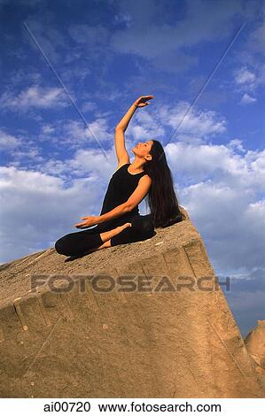 Woman doing Yoga outdoors View Large Photo Image Stock Image - Woman doing Yoga outdoors. Fotosearch