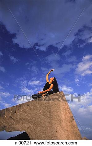 Woman doing Yoga outdoors View Large Photo Image Stock Image - Woman doing Yoga outdoors. Fotosearch