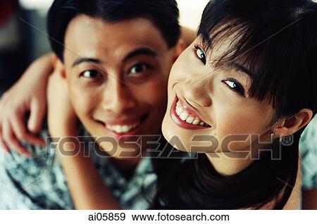 Woman embracing man, elevated view, portrait View Large Photo Image Stock Photo - Woman embracing man, elevated view, portrait. Fotosearch
