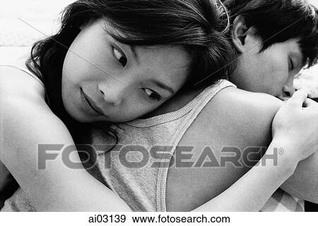 Woman embracing man View Large Photo Image Stock Photo - Woman embracing man. Fotosearch