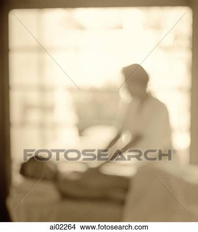 Woman getting a massage, window in background, defocused View Large Photo Image Picture - Woman getting a massage, window in background, defocused. Fotosearch