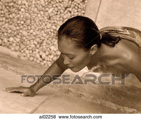 Woman getting wet by stream of water, topless View Large Photo Image Stock Photo - Woman getting wet by stream of water, topless. Fotosearch