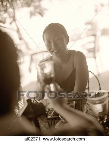 Woman holding wine glass sharing a toast. View Large Photo Image Stock Image - Woman holding wine glass sharing a toast.. Fotosearch