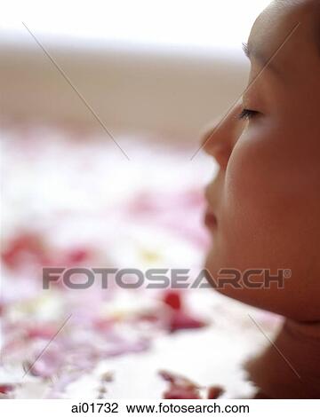 Woman in bath with floating flowers, profile View Large Photo Image Stock Image - Woman in bath with floating flowers, profile. Fotosearch
