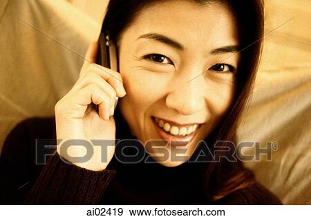 Woman in black turtleneck using cellular phone. View Large Photo Image Stock Photo - Woman in black turtleneck using cellular phone.. Fotosearch