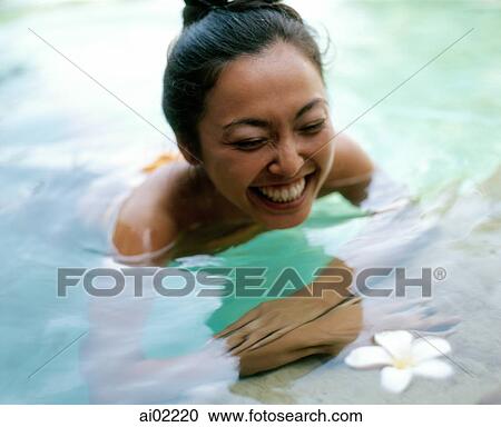 Woman in pool smiling View Large Photo Image Stock Image - Woman in pool smiling. Fotosearch
