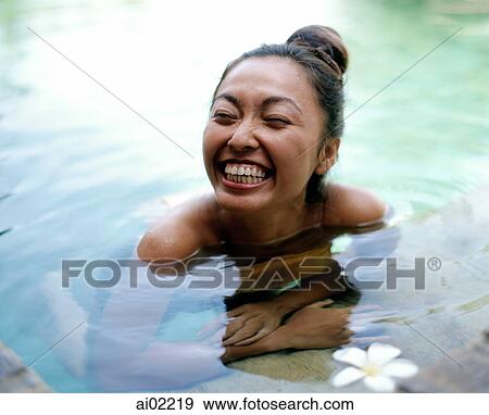 Woman in pool smiling View Large Photo Image Stock Photo - Woman in pool smiling. Fotosearch
