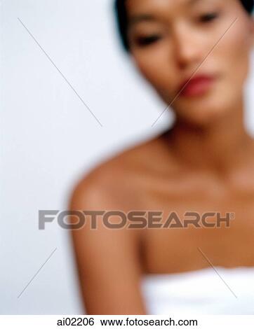 Woman looking at camera, defocused, white background View Large Photo Image Stock Photograph - Woman looking at camera, defocused, white background. Fotosearch