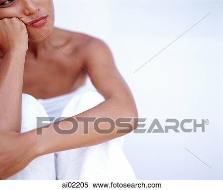 Stock Photography - Woman looking off camera, portrait, white background. Fotosearch