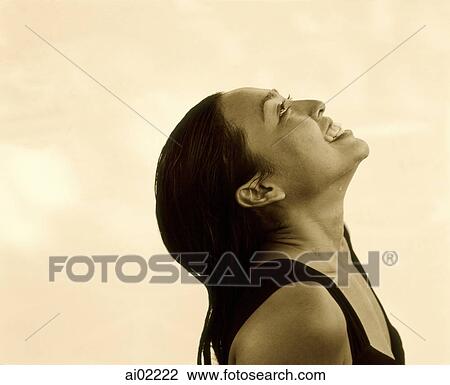 Woman looking upwards, profile, white background View Large Photo Image Stock Image - Woman looking upwards, profile, white background. Fotosearch